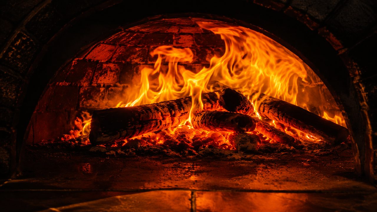 Flames inside the wood-fired brick oven